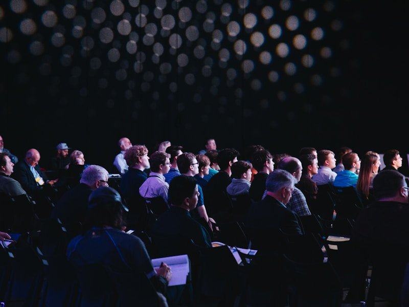Audience members engaged in a live corporate program
